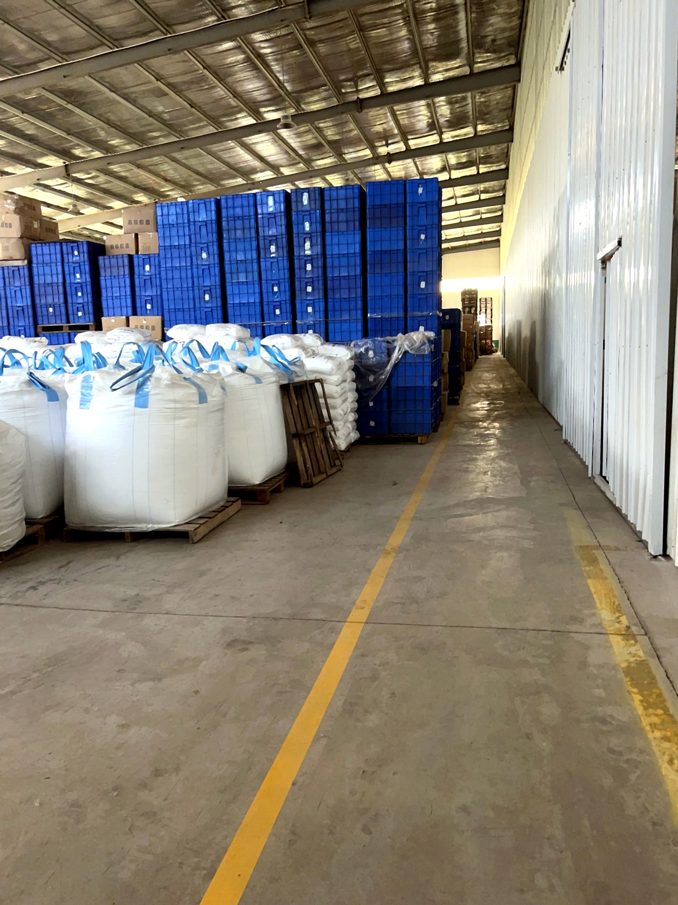 Warehouse aisle beside stored materials